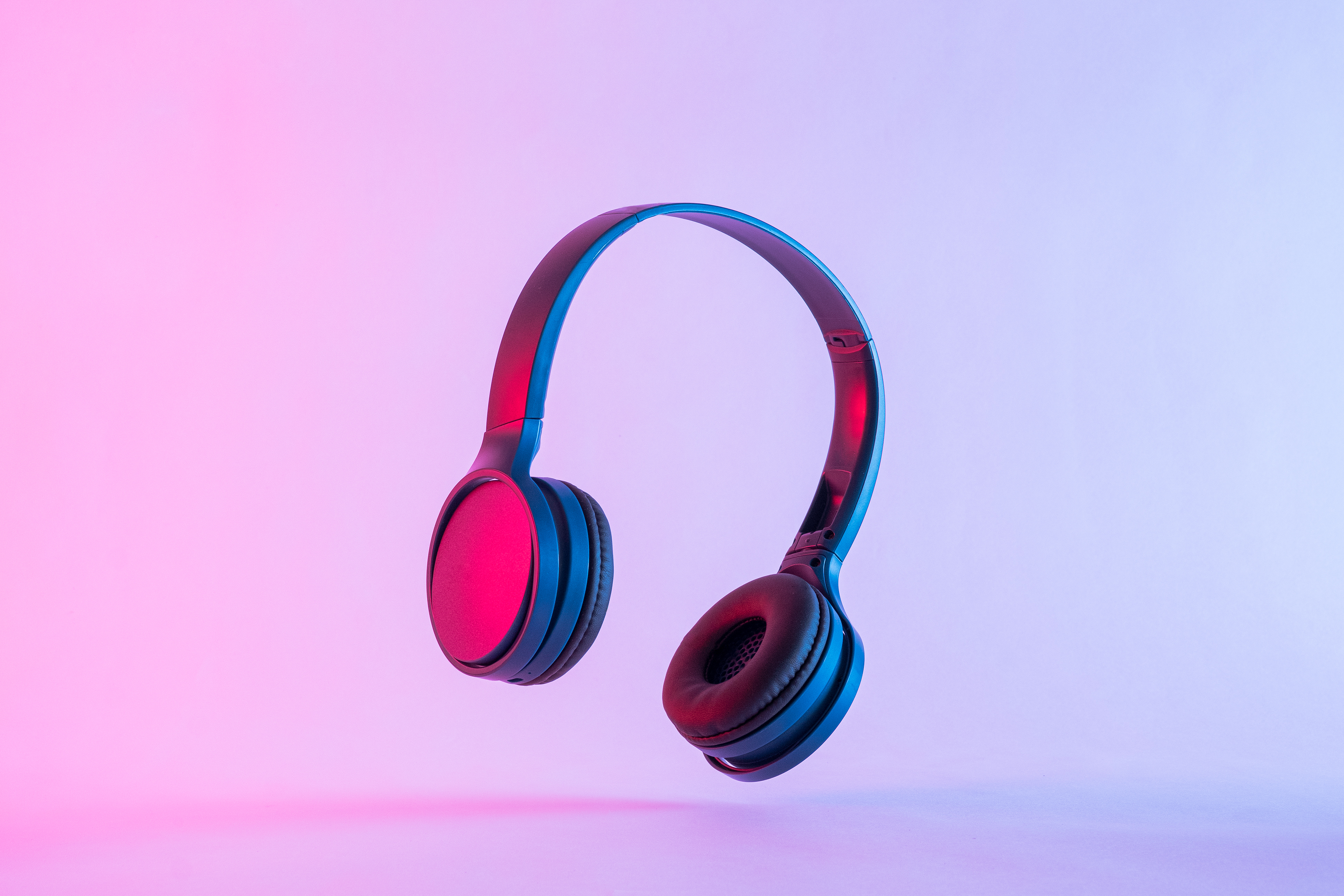 Headphones in neon pastel lighting